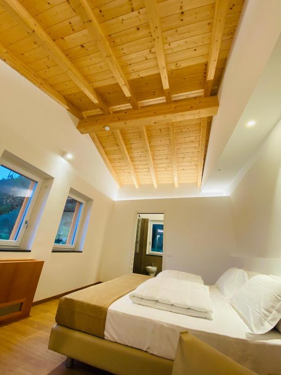 Postel nebo postele na pokoji v ubytování Agriturismo Terre di Ginepro