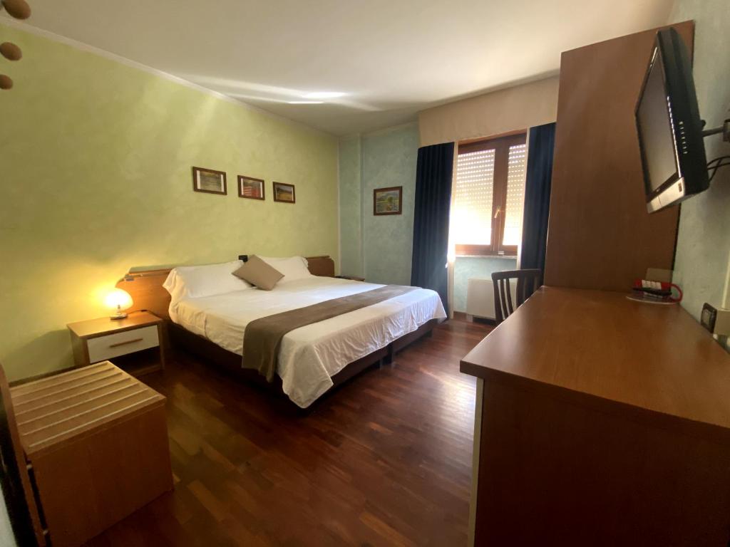 Postel nebo postele na pokoji v ubytování Sole della Franciacorta - Hotel & Restaurant