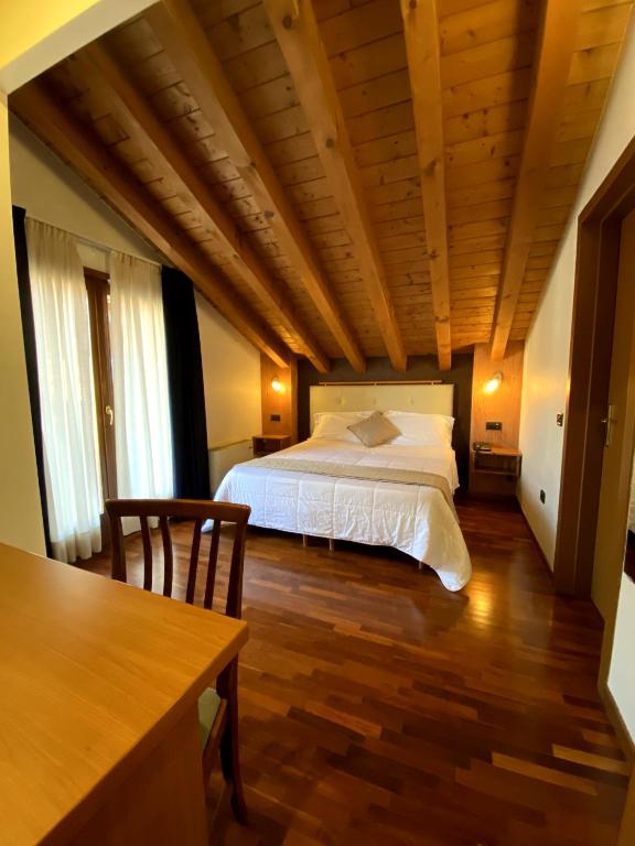 Postel nebo postele na pokoji v ubytování Sole della Franciacorta - Hotel & Restaurant