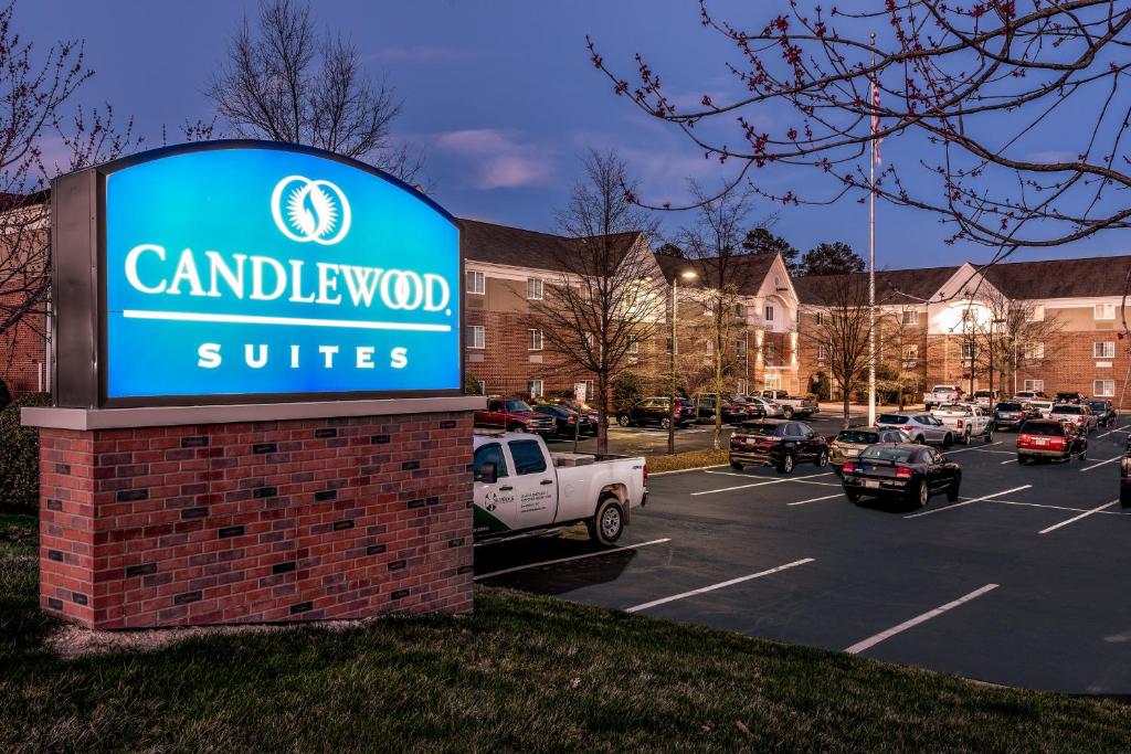 a sign for a car dealership in a parking lot at Candlewood Suites Richmond West End Short Pump, an IHG Hotel in Short Pump