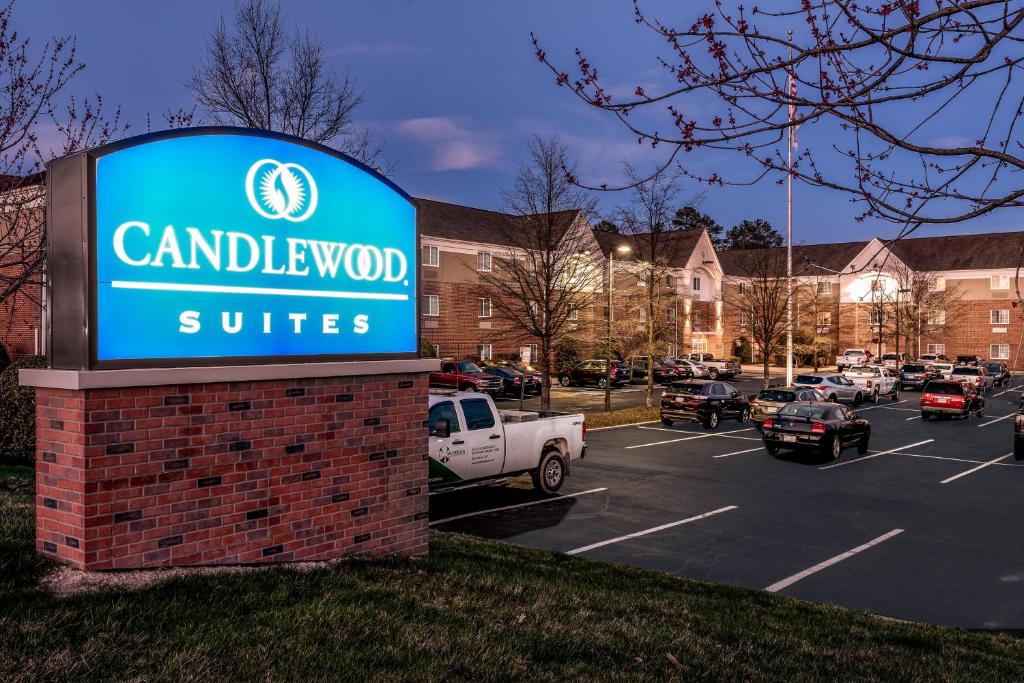 a sign for a car dealership in a parking lot at Candlewood Suites Glen Allen-Short Pump in Glen Allen