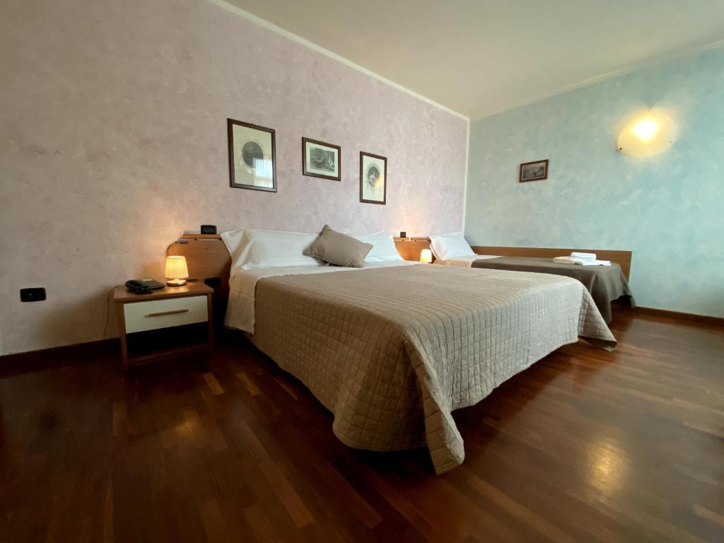 Postel nebo postele na pokoji v ubytování Sole della Franciacorta - Hotel & Restaurant