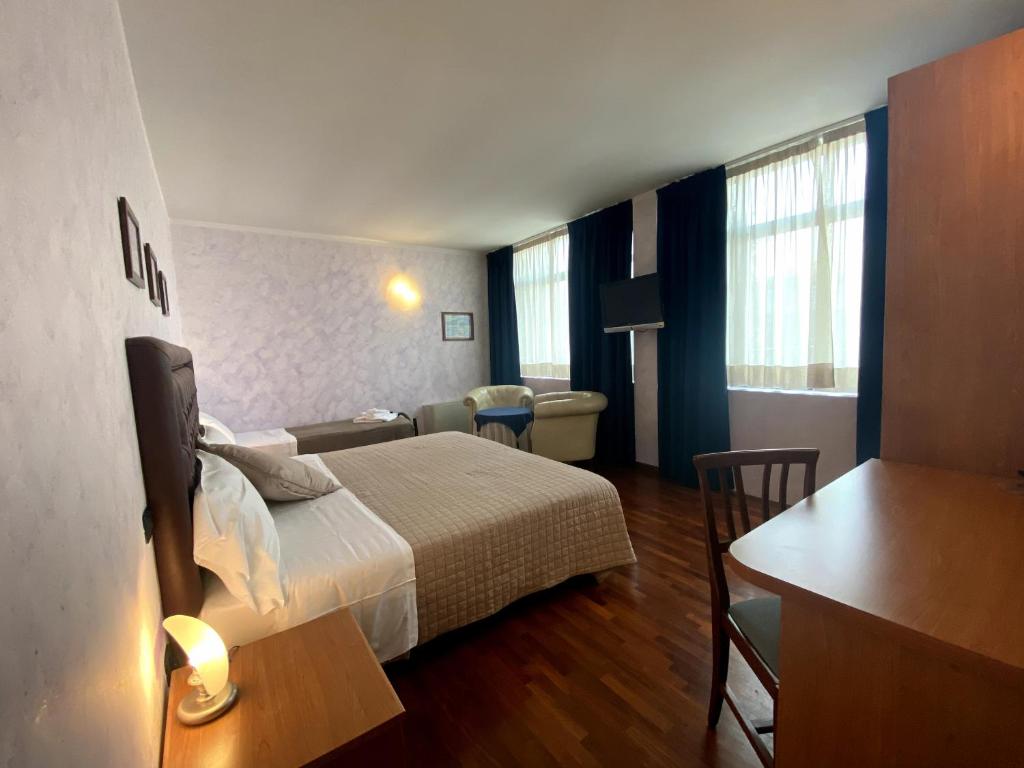 Postel nebo postele na pokoji v ubytování Sole della Franciacorta - Hotel & Restaurant