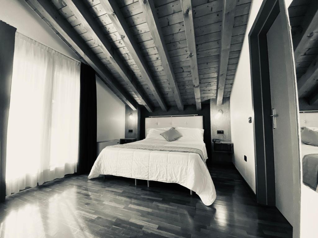 Postel nebo postele na pokoji v ubytování Sole della Franciacorta - Hotel & Restaurant