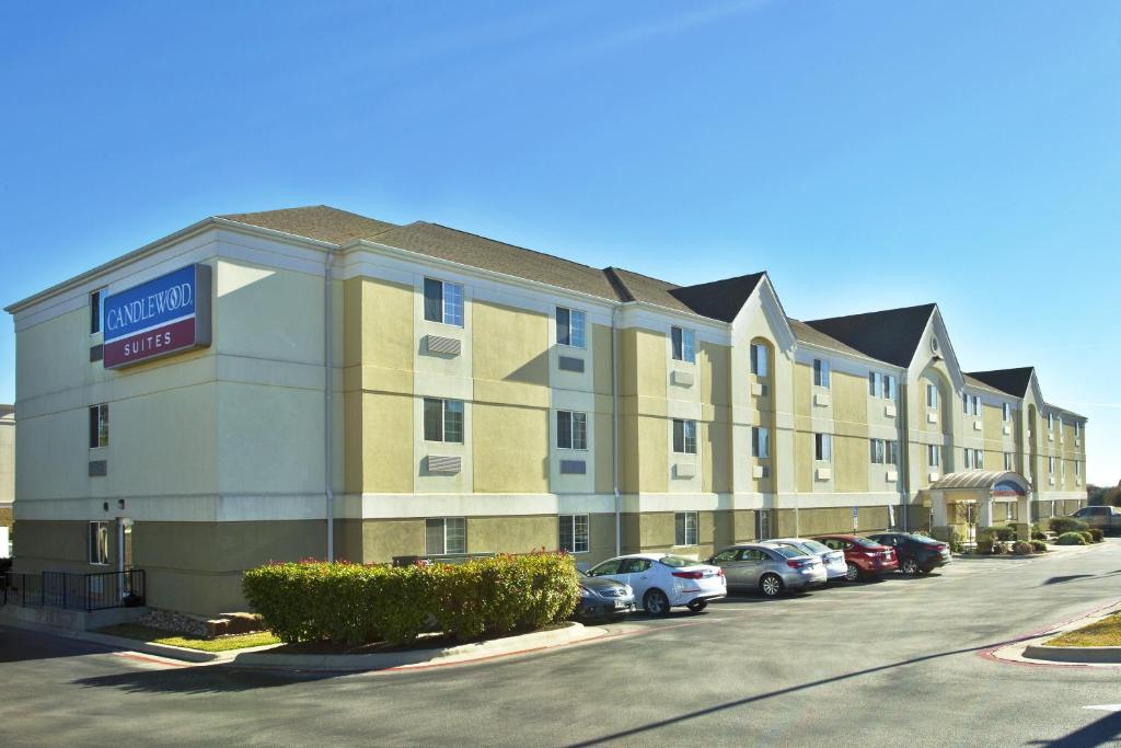 a hotel building with cars parked in a parking lot at Candlewood Suites Killeen - Fort Hood Area by IHG in Killeen