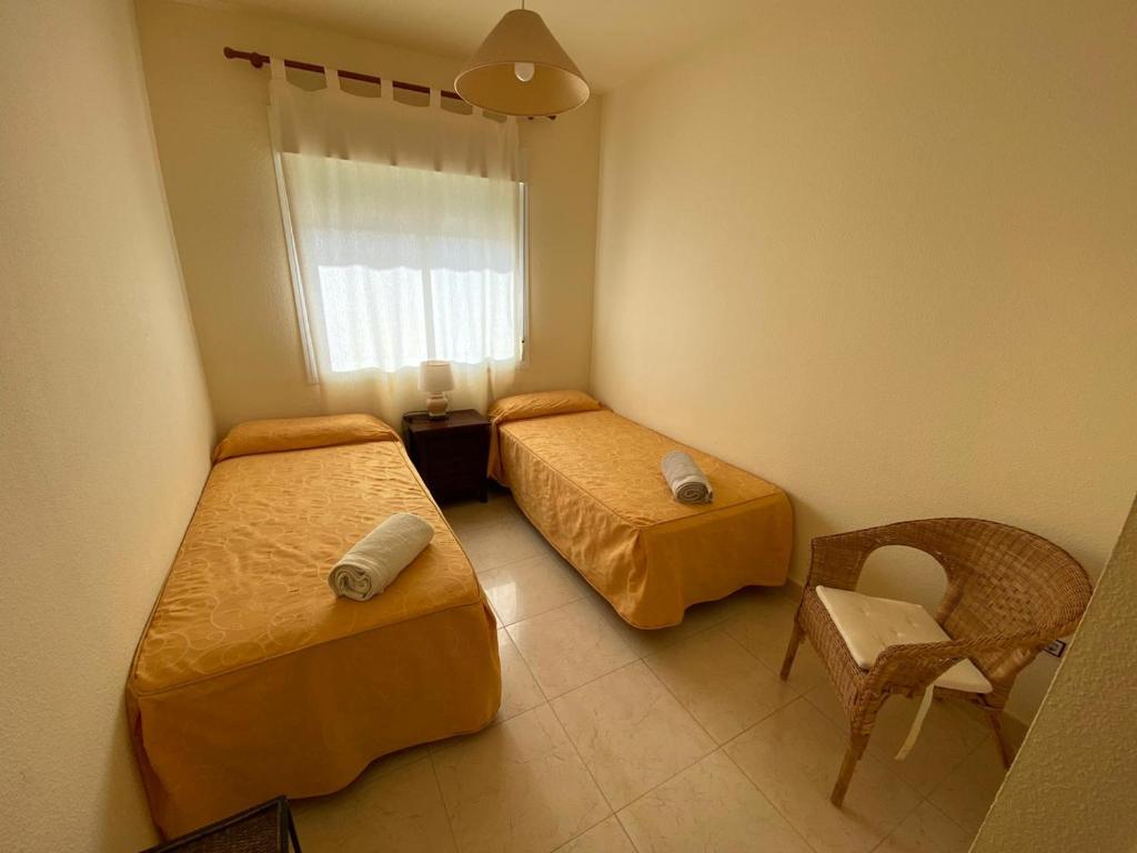 Postel nebo postele na pokoji v ubytování Apartamento en Bahia Golf - Costa Ballena