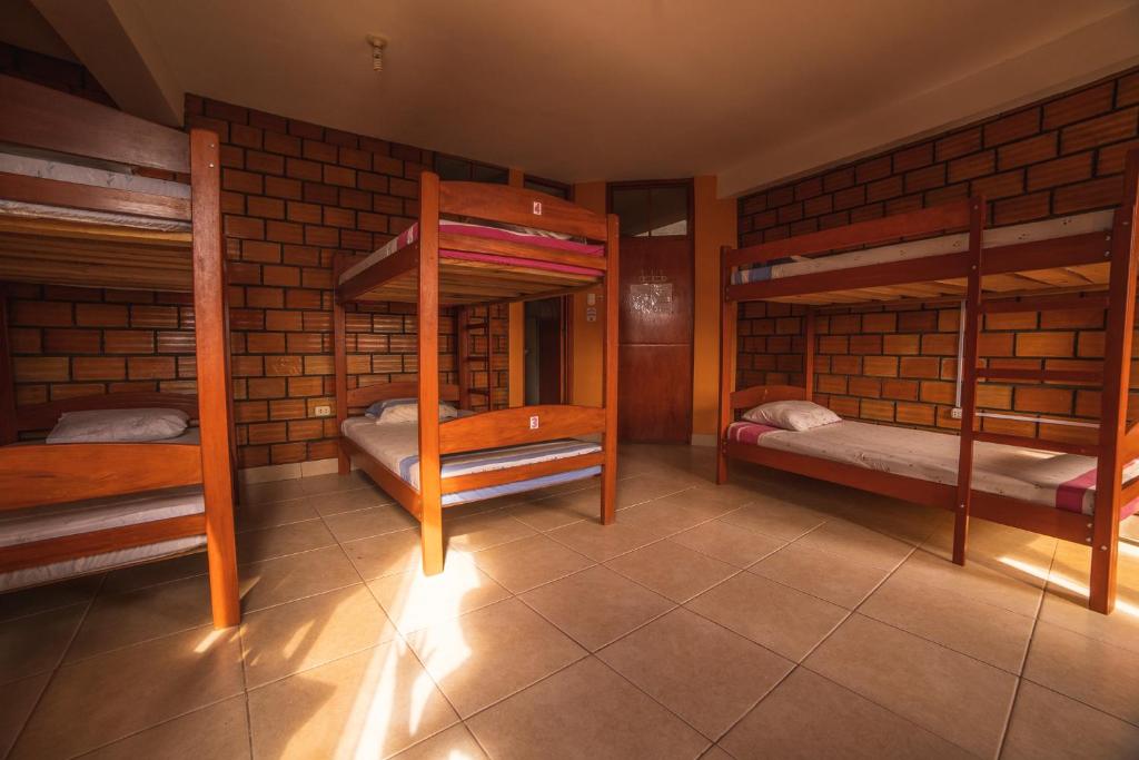 Postel nebo postele na pokoji v ubytování El Mural Backpackers