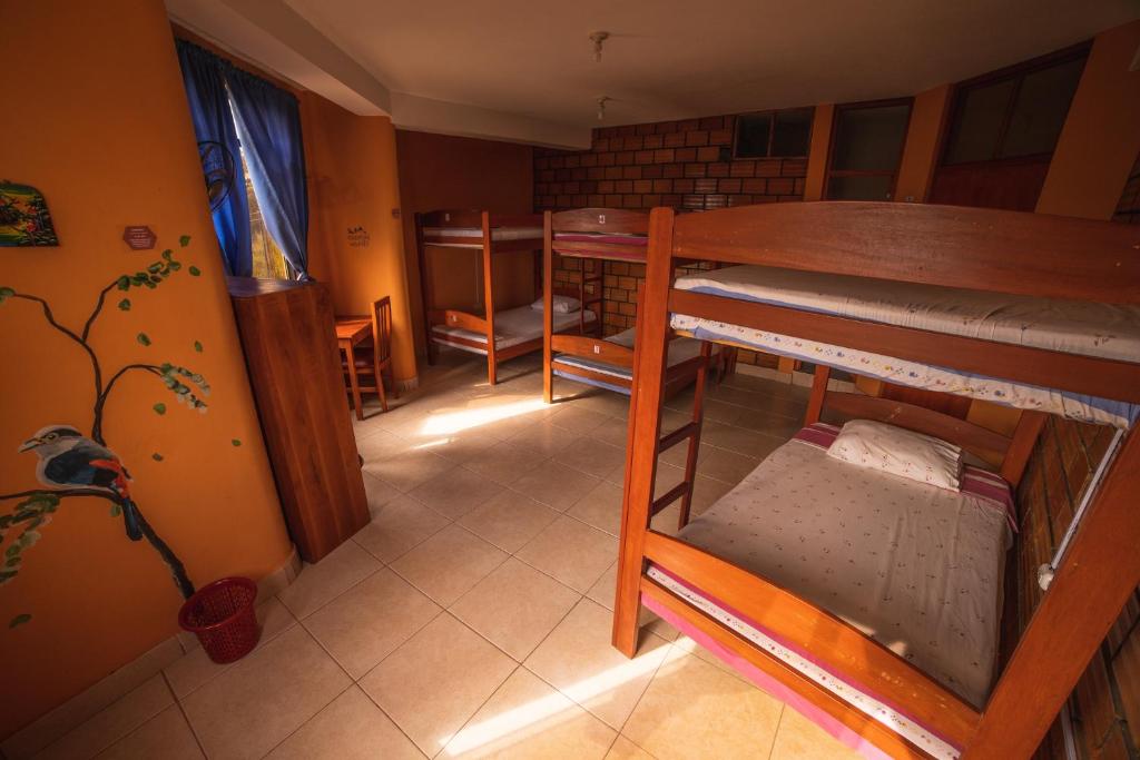 Postel nebo postele na pokoji v ubytování El Mural Backpackers