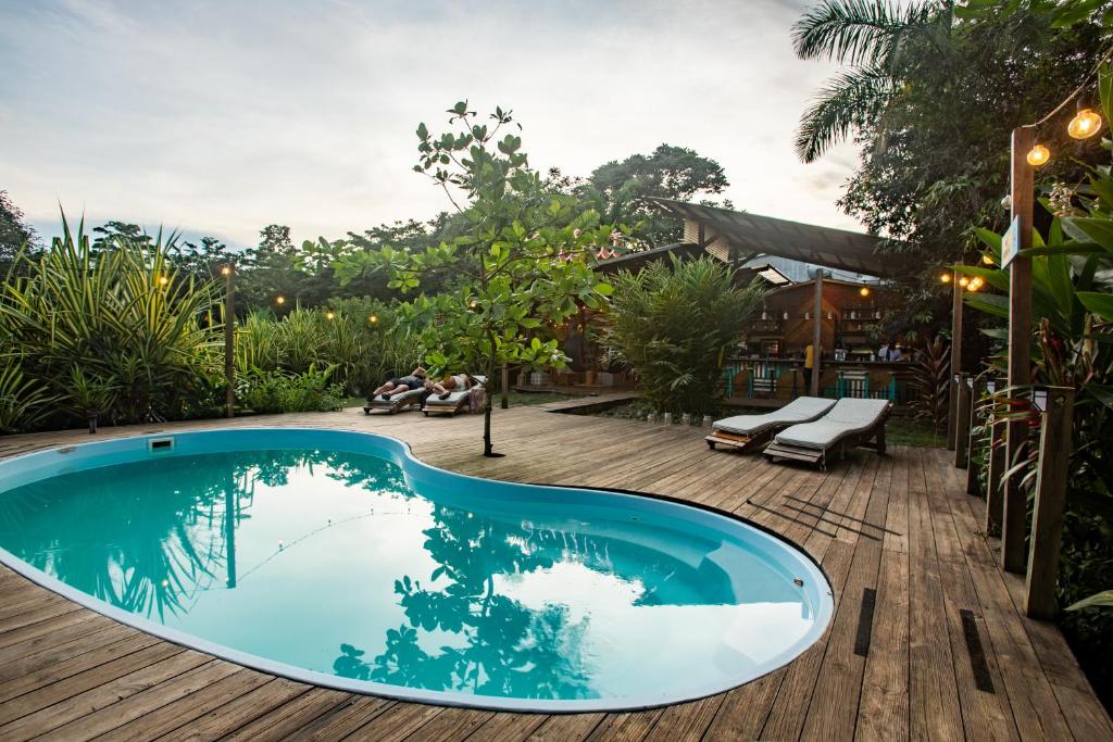 a swimming pool in the middle of a wooden deck at Selina Red Frog in Bocas del Toro