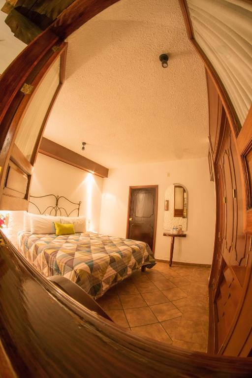 Postel nebo postele na pokoji v ubytování Hotel Mesón de los Remedios