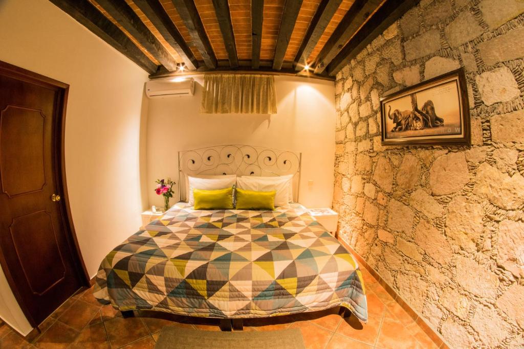 Postel nebo postele na pokoji v ubytování Hotel Mesón de los Remedios
