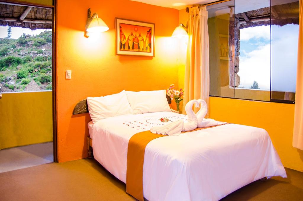 Postel nebo postele na pokoji v ubytování Hotel Kuntur Wassi