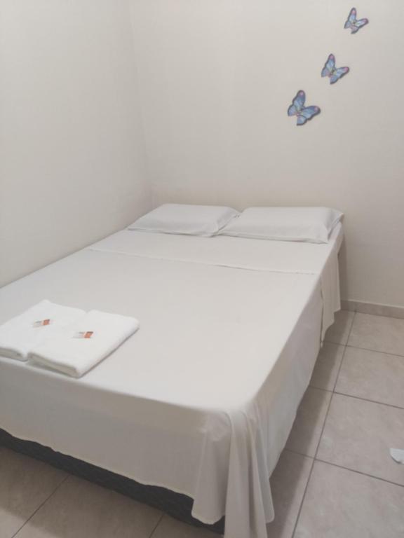 Uma cama ou camas num quarto em Pousada do Professor