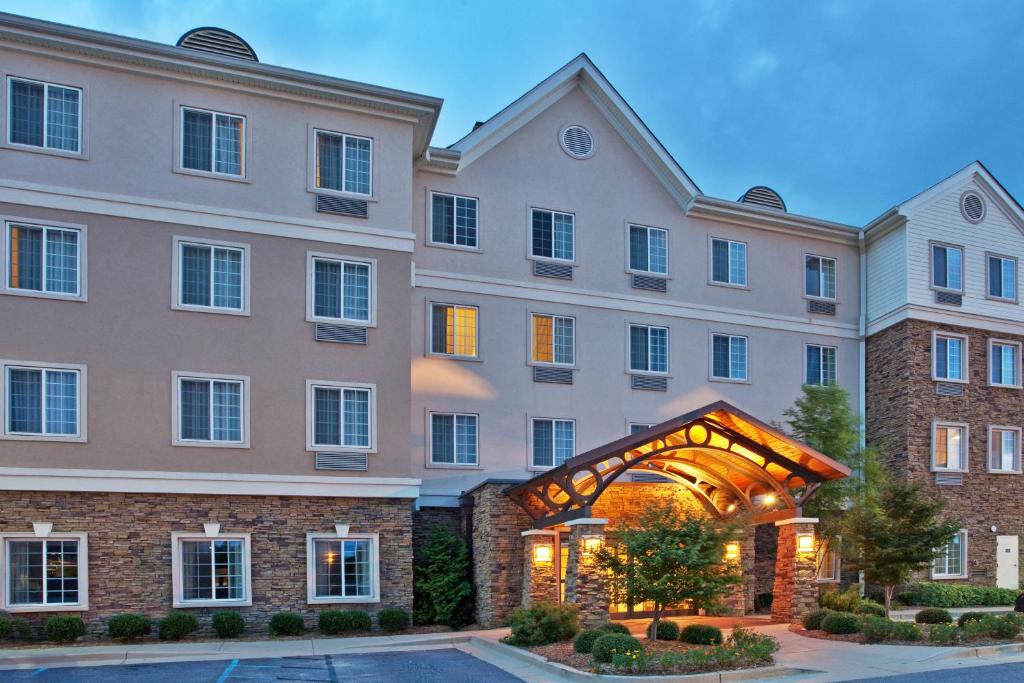 a rendering of the front of a hotel at Staybridge Suites Columbus - Fort Benning, an IHG Hotel in Columbus