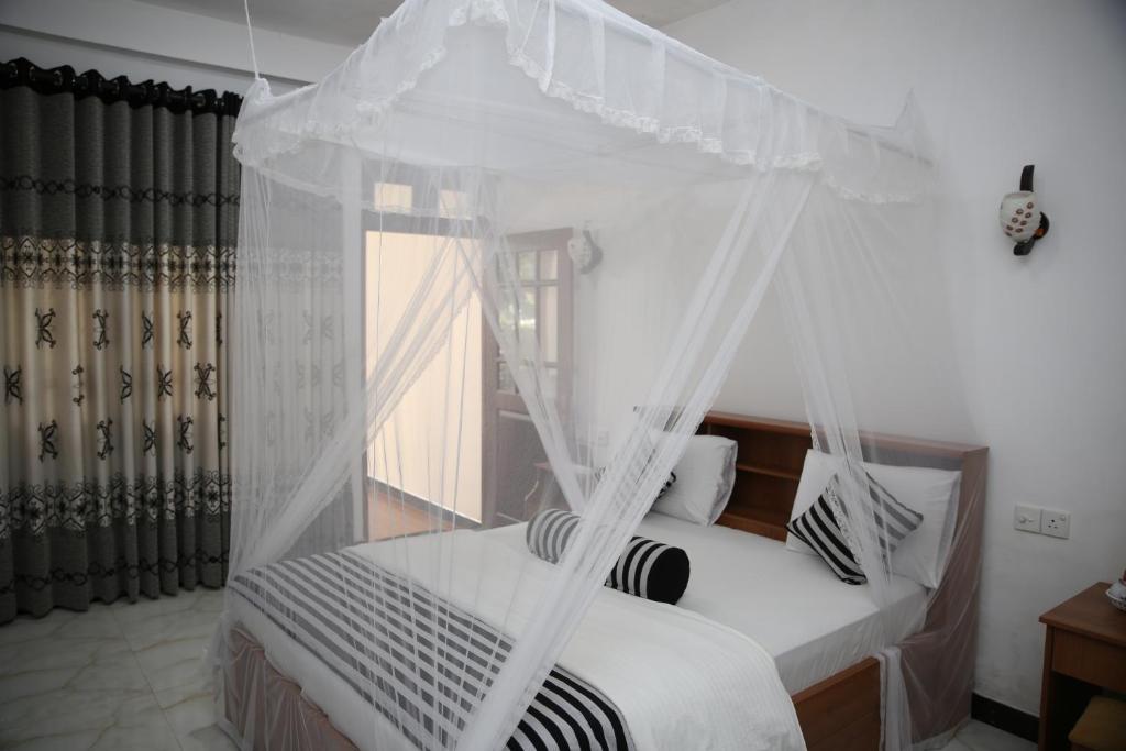 En eller flere senge i et værelse på The Dream Resort