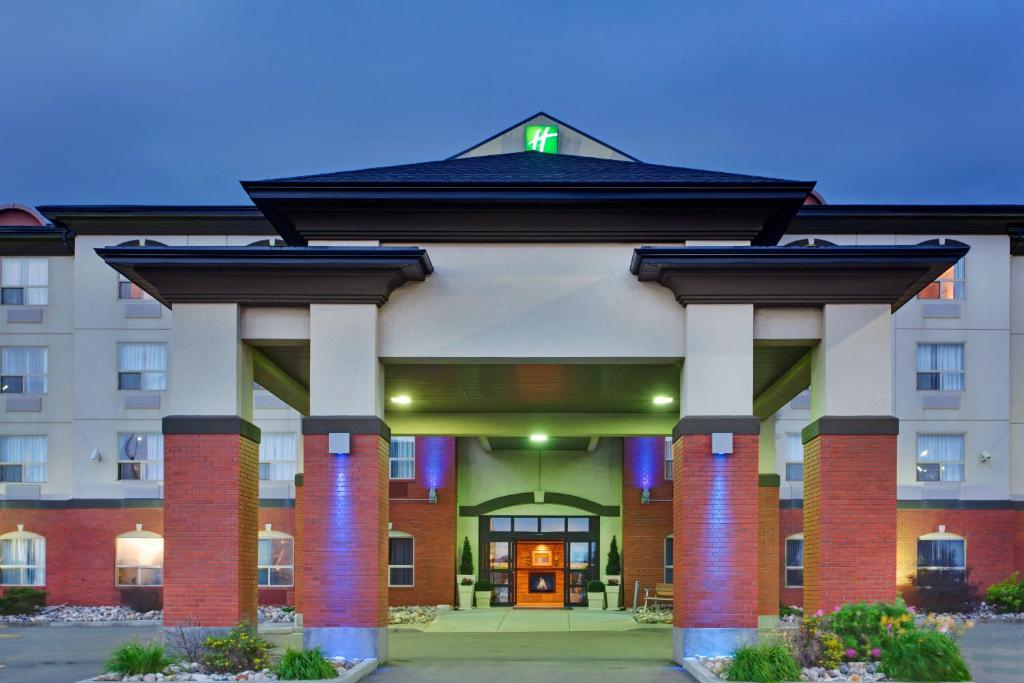 a large building with a front porch with columns at Holiday Inn Express Hotel & Suites Sherwood Park-Edmonton Area, an IHG Hotel in Sherwood Park