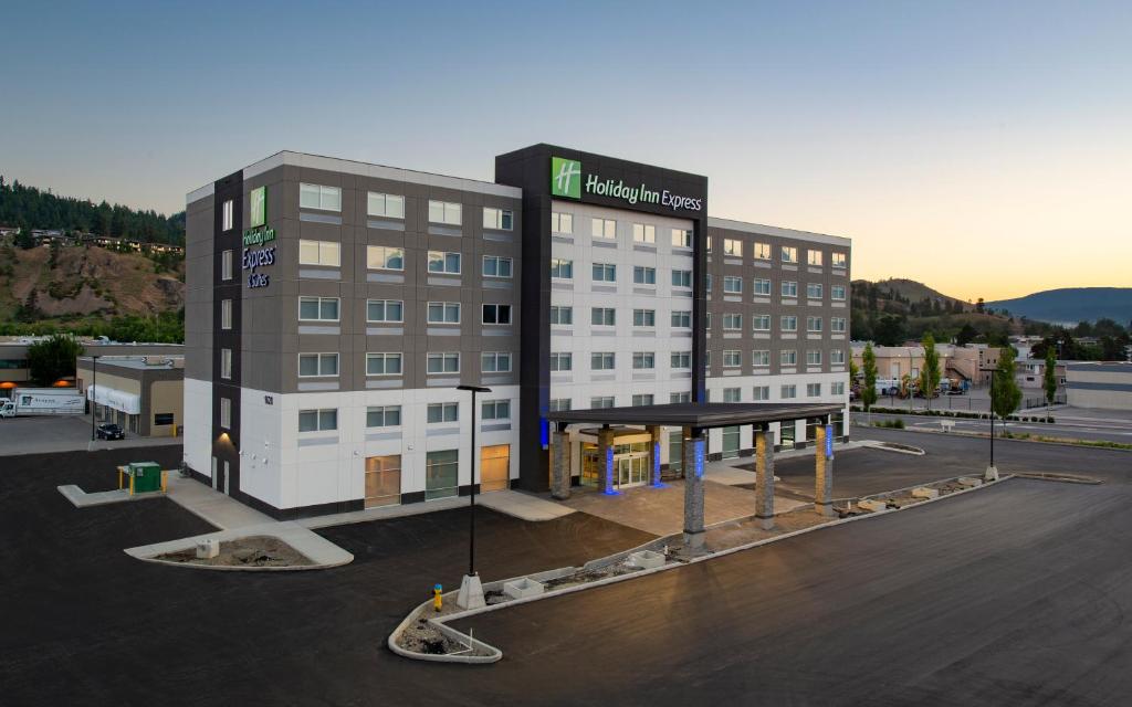 a rendering of a hotel in a parking lot at Holiday Inn Express & Suites Kelowna - East, an IHG Hotel in Kelowna