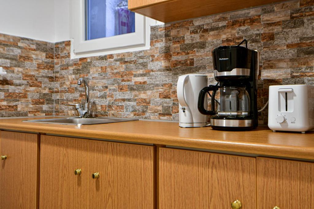 Kuchnia lub aneks kuchenny w obiekcie Thiras Lovely Apartment BY ZAIN