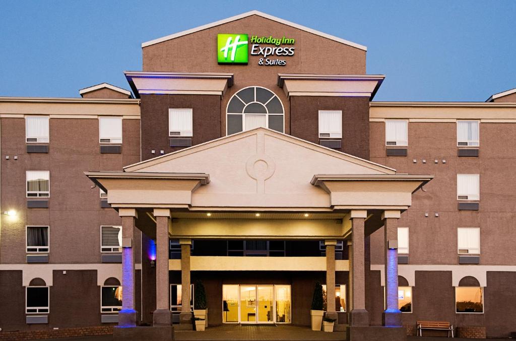 a front view of a hotel with the zeus series sign on it at Holiday Inn Express & Suites-Regina-South, an IHG Hotel in Regina