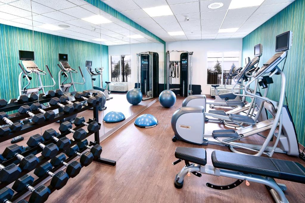 a gym with treadmills and elliptical machines at Holiday Inn Express Hotel & Suites Dieppe Airport, an IHG Hotel in Moncton