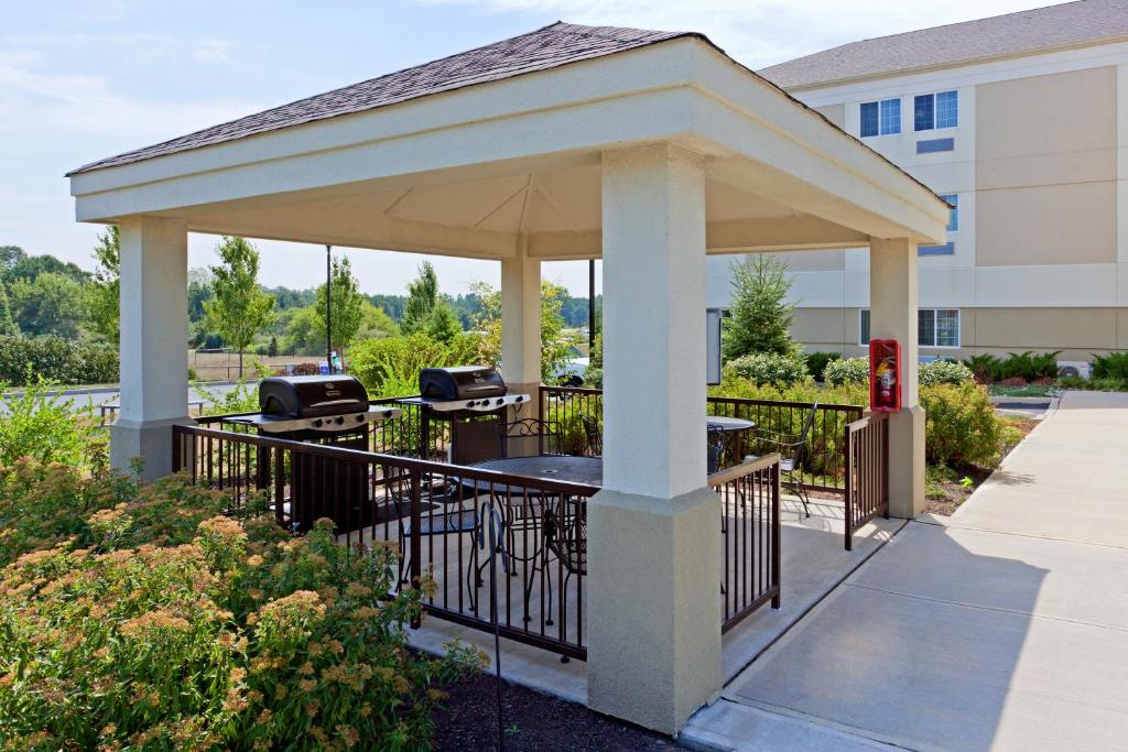 a gazebo with a grill on a sidewalk at Candlewood Suites Bordentown-Trenton, an IHG Hotel in Bordentown