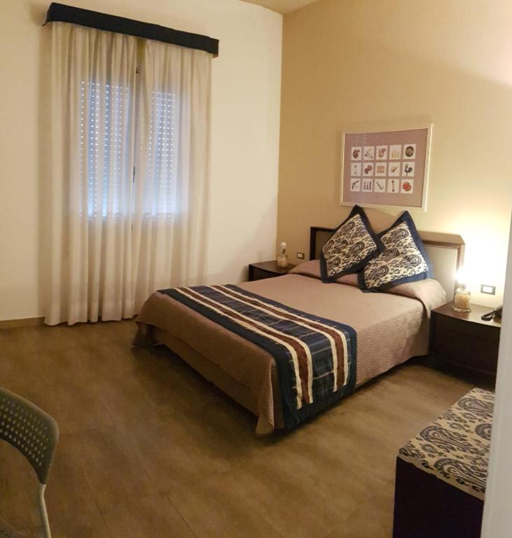 Postel nebo postele na pokoji v ubytování Hotel Le Calandre