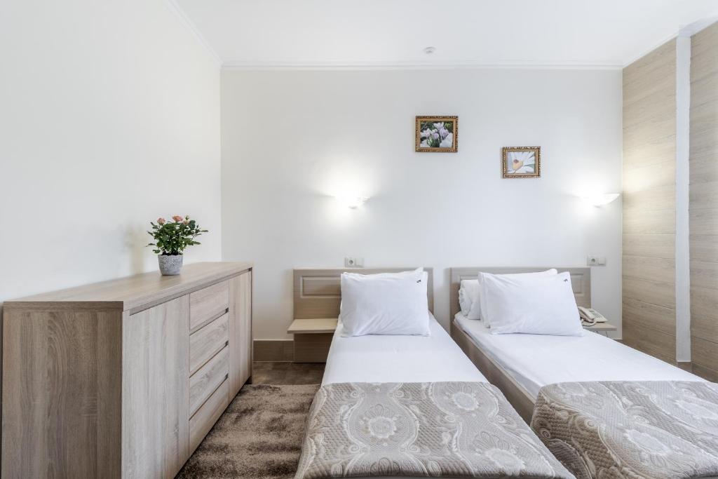 Postel nebo postele na pokoji v ubytování Hotel Adrenalin