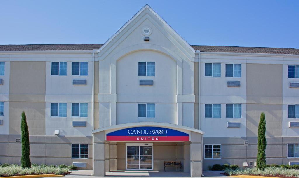 a rendering of the entrance to a cranbrook hotel at Candlewood Suites Port Arthur/Nederland, an IHG Hotel in Nederland