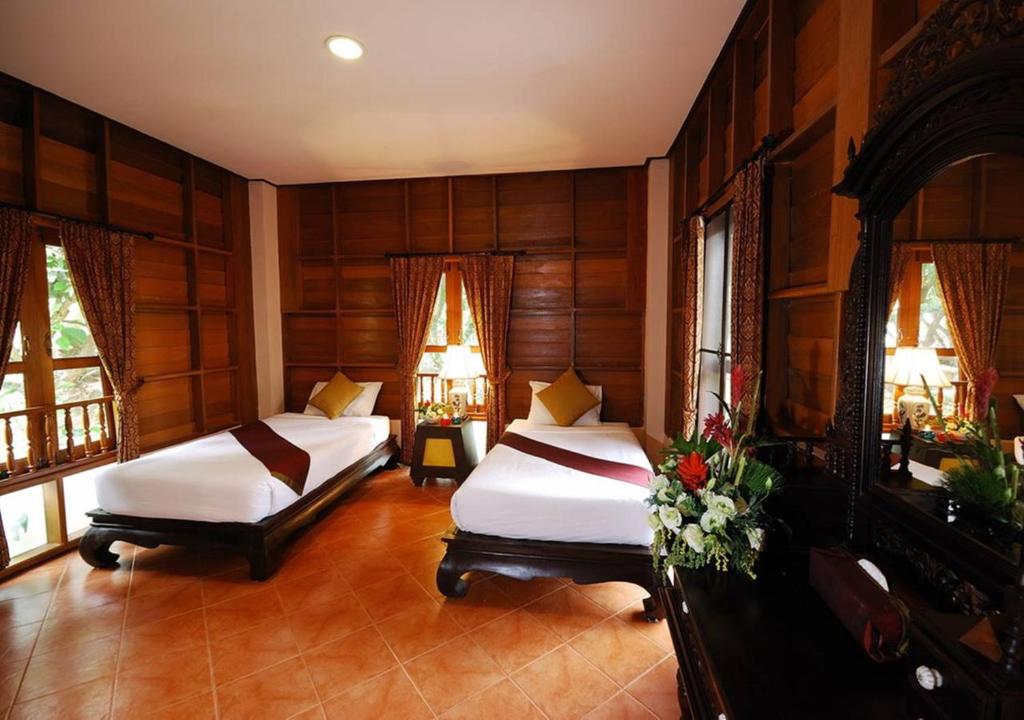 Cama o camas de una habitación en Phuwanalee Resort