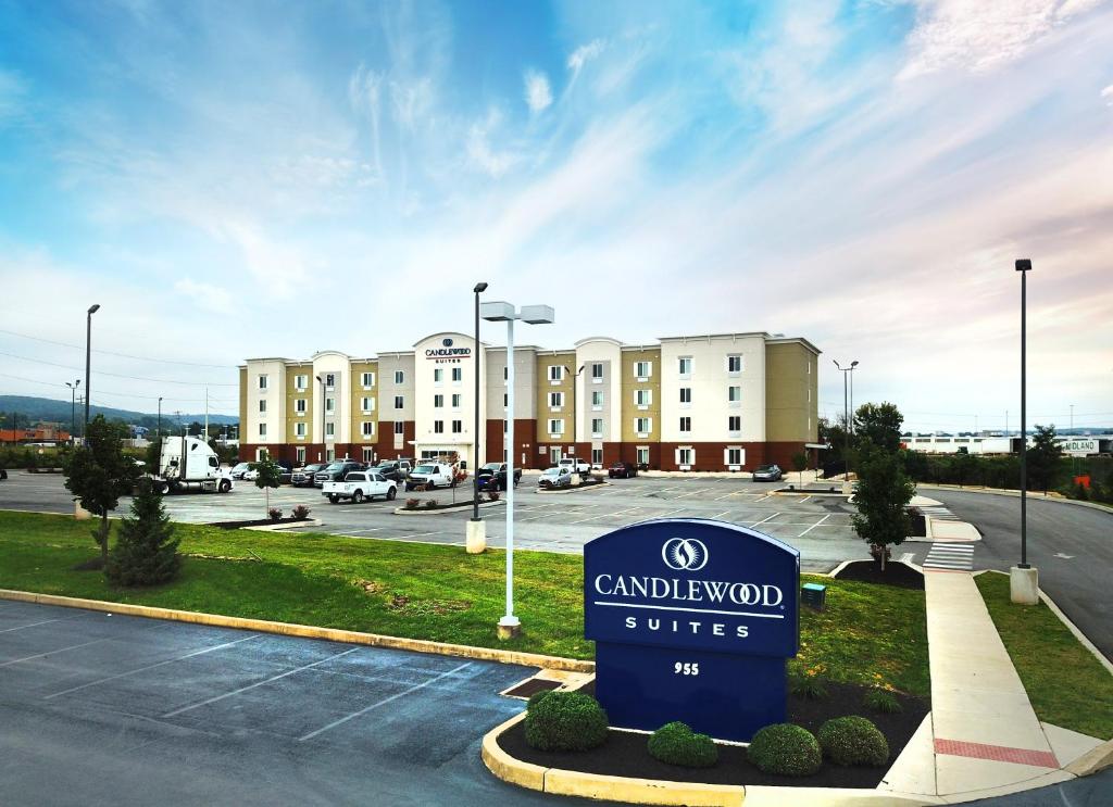 a sign in a parking lot in front of a building at Candlewood Suites York, an IHG Hotel in York