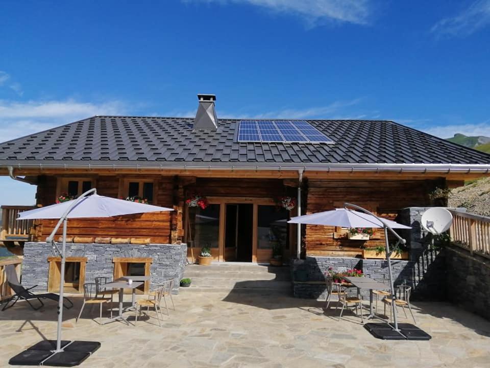 a house with solar panels on the roof at Chambres et Tables d'Hôtes Le Choton à Nono - Col du Joly Beaufortain in Hauteluce
