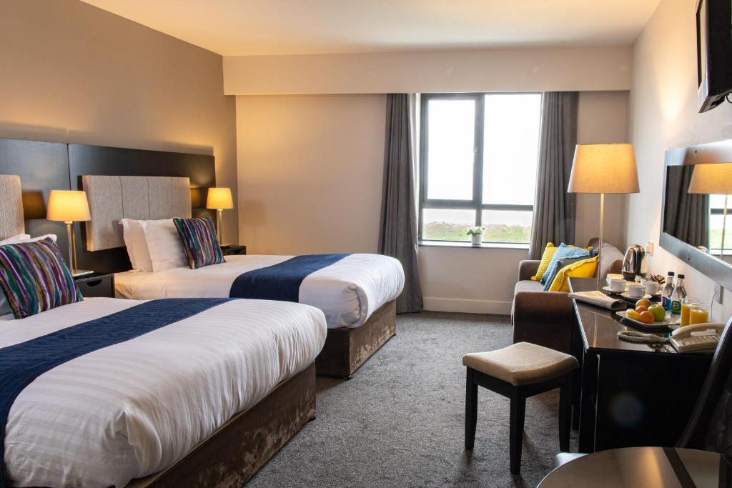 Postel nebo postele na pokoji v ubytování Ocean Sands Hotel