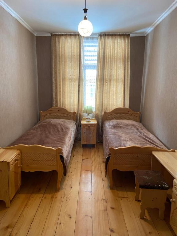 Postel nebo postele na pokoji v ubytování ELISO'S GUESTHOUSE