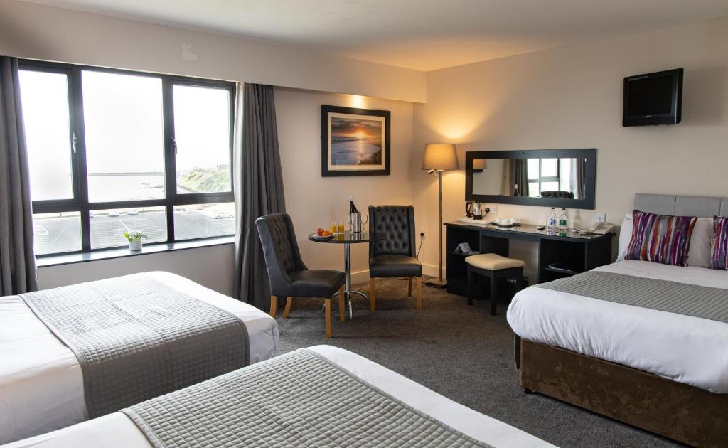 Postel nebo postele na pokoji v ubytování Ocean Sands Hotel
