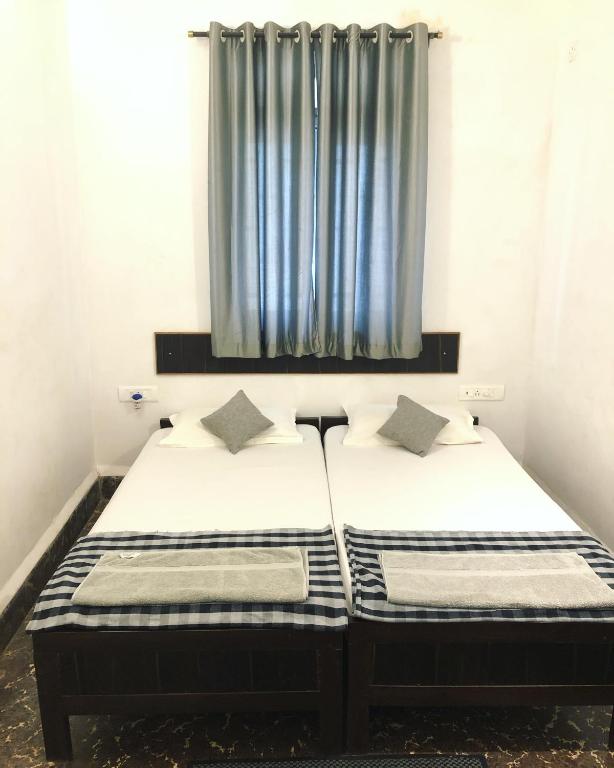 Postel nebo postele na pokoji v ubytování Hotel Paulino