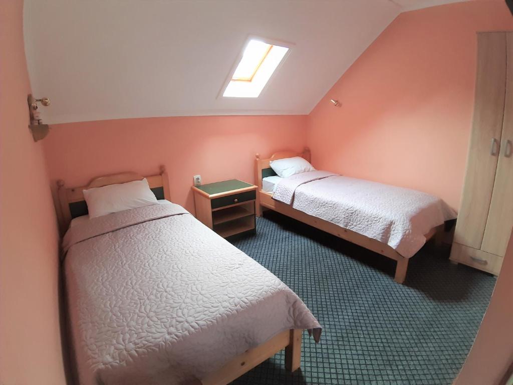 Ein Bett oder Betten in einem Zimmer der Unterkunft Vila Palma Palic