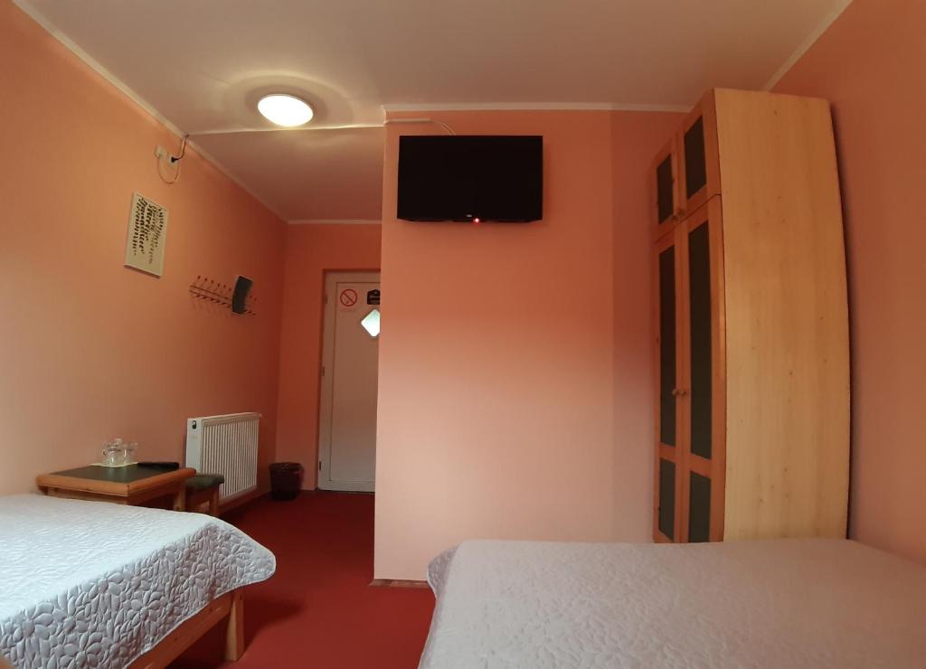 Ein Bett oder Betten in einem Zimmer der Unterkunft Vila Palma Palic