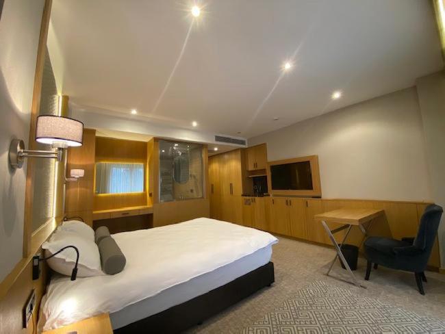 Postel nebo postele na pokoji v ubytování Bella Hotel