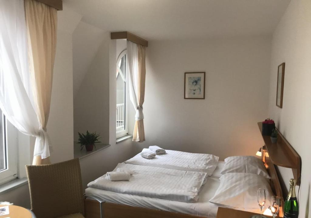 Postel nebo postele na pokoji v ubytování Hotel Otar