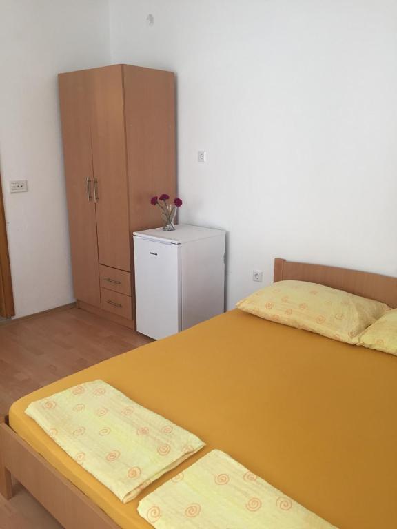 Postel nebo postele na pokoji v ubytování Apartment and Rooms Barbaric