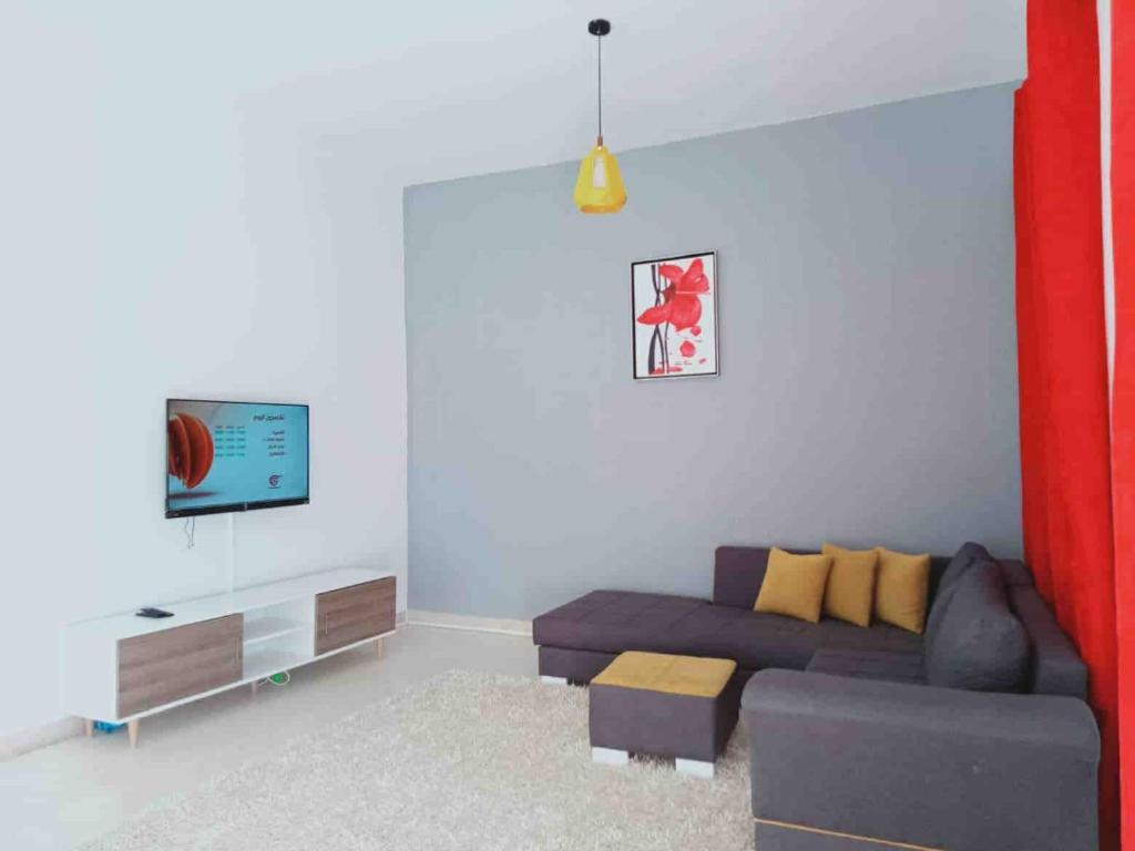 TV a/nebo společenská místnost v ubytování Appartement Manzah 6