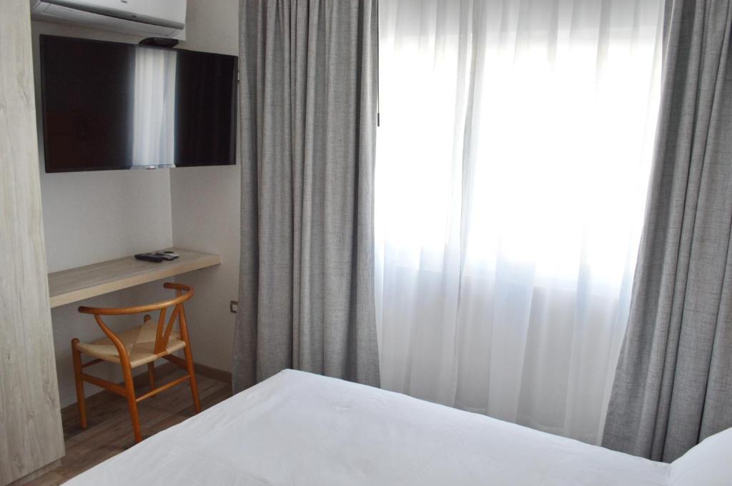 TV a/nebo společenská místnost v ubytování Hotel Cinco Tierras