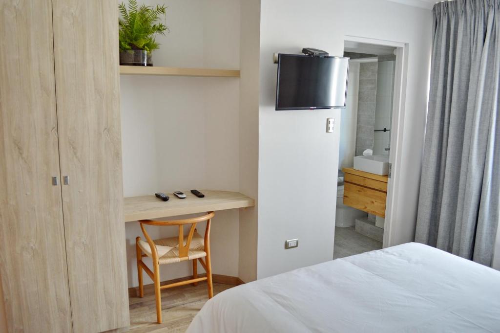 Postel nebo postele na pokoji v ubytování Hotel Cinco Tierras