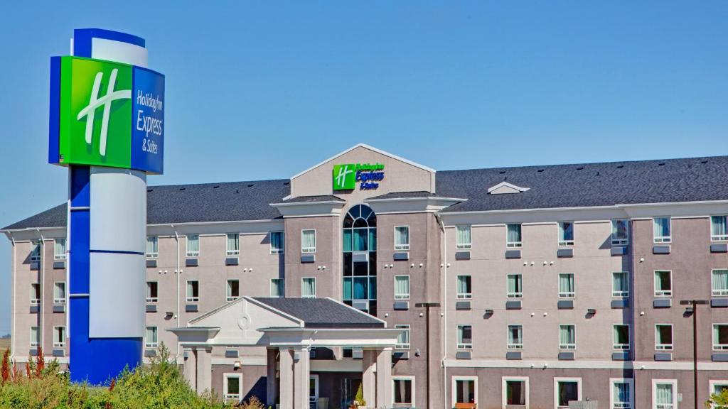 a large building with a sign in front of it at Holiday Inn Express Hotel & Suites Swift Current by IHG in Swift Current