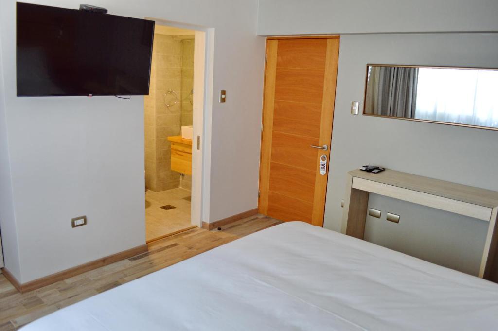 Postel nebo postele na pokoji v ubytování Hotel Cinco Tierras