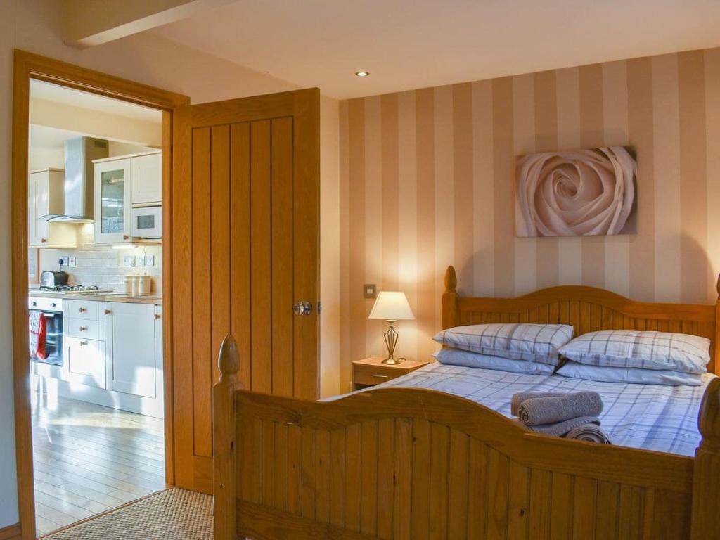 מיטה או מיטות בחדר ב-River Cottage