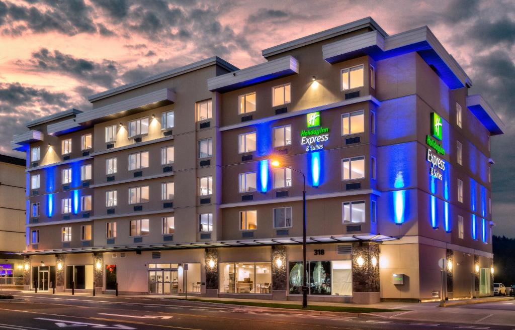 a hotel with blue lights on the side of a building at Holiday Inn Express & Suites Victoria-Colwood, an IHG Hotel in Victoria
