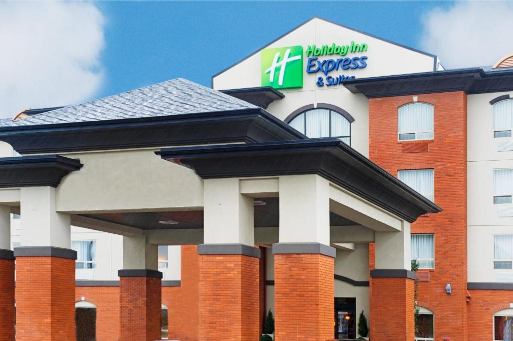 a hotel with a sign on top of it at Holiday Inn Express Hotel & Suites - Slave Lake, an IHG Hotel in Slave Lake