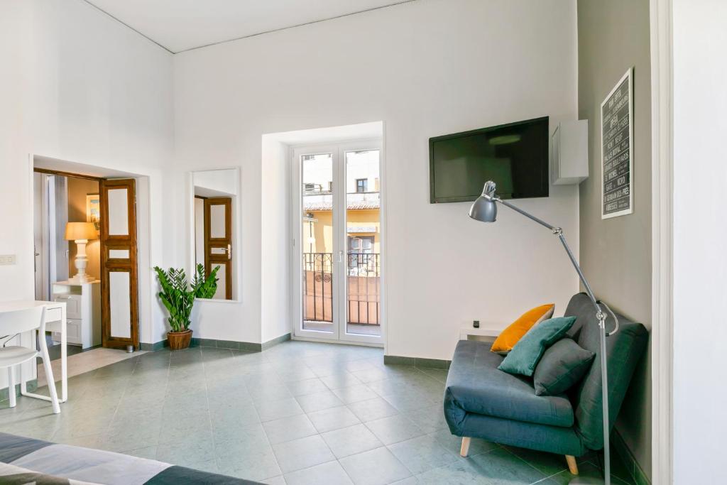 Televízia a/alebo spoločenská miestnosť v ubytovaní Stylish Flat Maqueda