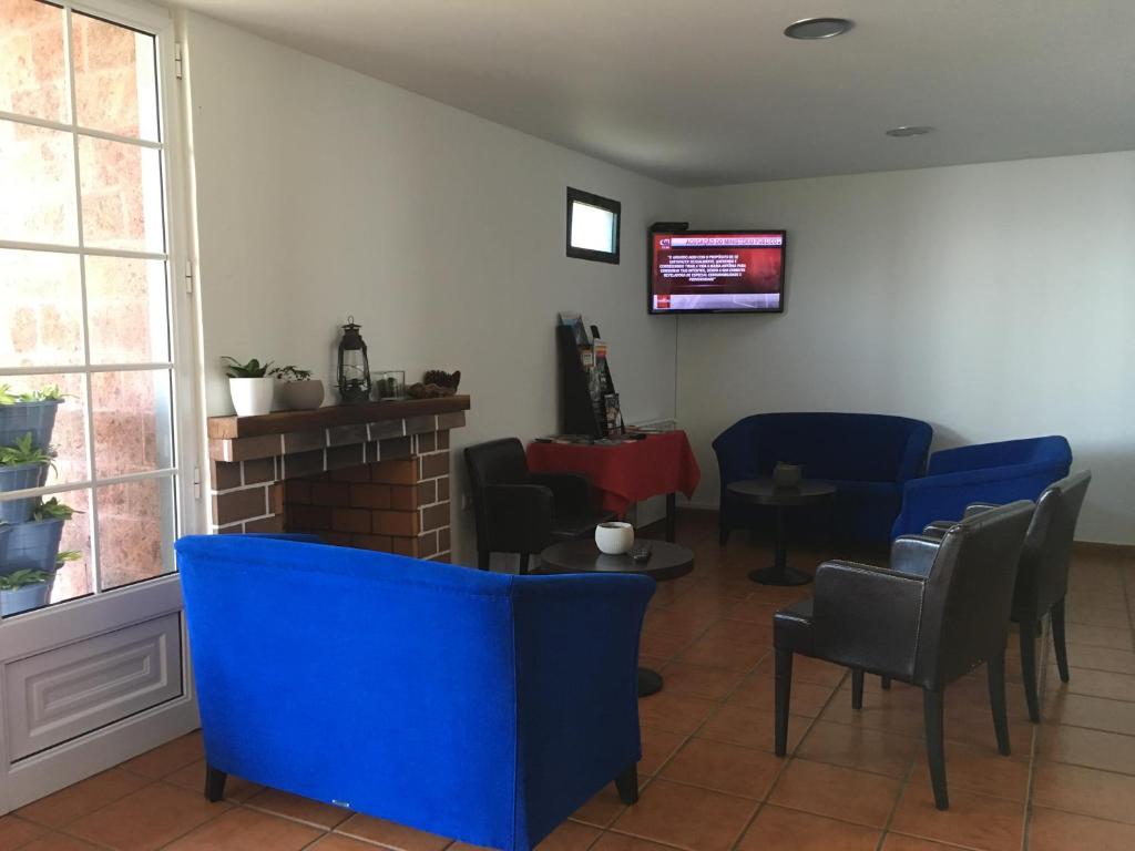 TV a/nebo společenská místnost v ubytování Casa do Til
